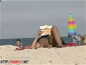 molten honies filmed lounging on a nudist beach